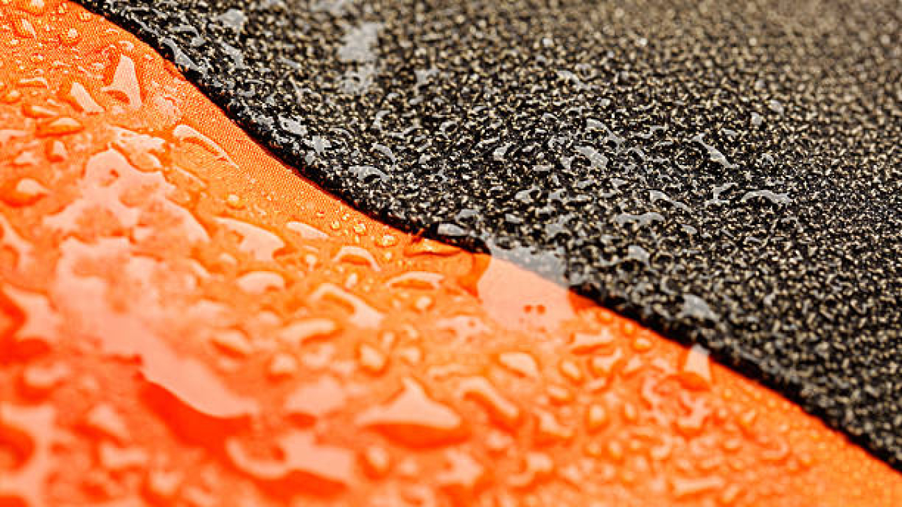 "Waterproof textile  with water droplets. Close - up, macro. Very shallow DOF. The grain and texture added.SEE ALSO:"